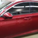 red car door glass tint work